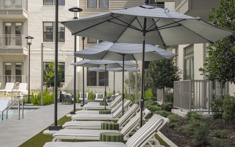 Perfect Outdoor space with comfortable loungers with umbrellas overlooking the pool