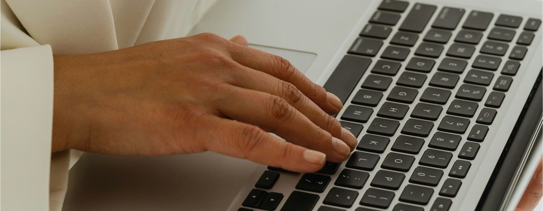 a person typing on a laptop
