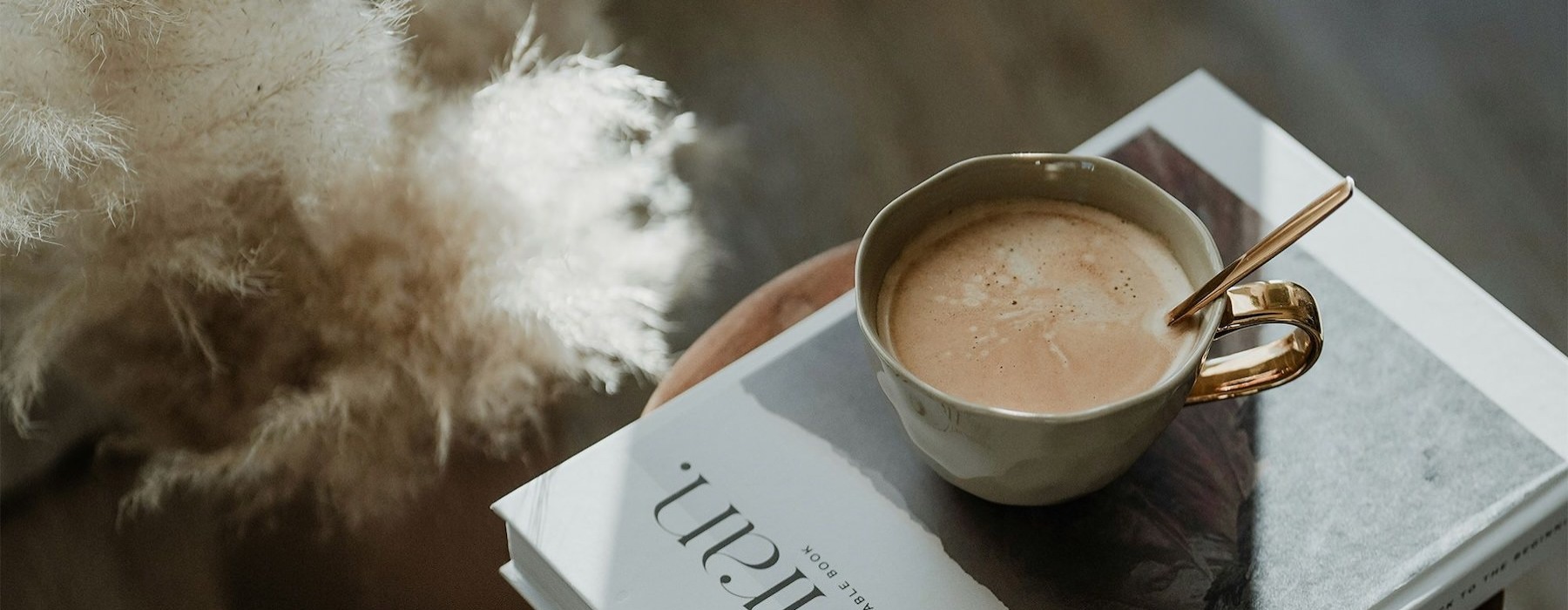 a cup of coffee on a book